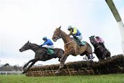 29 December 2010; Hurricane Fly, left, with Paul Townend up, jumps the last with eventual third place Luska Lad, centre, with Andrew McNamara up, and eventual second place Solwith, with Davy Russell up, on their way to winning The paddypower.com iPhone App December Festival Hurdle. Leopardstown Christmas Racing Festival 2010, Leopardstown Racecourse, Leopardstown, Dublin. Picture credit: Matt Browne / SPORTSFILE