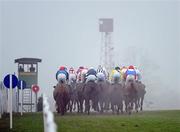 30 December 2010; Runners and riders face into the foggy conditions during The Bord na Mona Clean Air Maiden Hurdle. Leopardstown Christmas Racing Festival 2010, Leopardstown Racecourse, Leopardstown, Dublin. Picture credit: Stephen McCarthy / SPORTSFILE