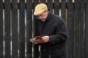 31 December 2010; Michael Doodey, from Grangecon, Co. Wicklow, studies his racecard. Punchestown Racecourse, Punchestown, Co. Kildare. Photo by Sportsfile