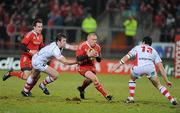 1 January 2011; Keith Earls, Munster, in action against Willie Faloon, left, and Ian Whitten, Ulster. Celtic League, Munster v Ulster, Thomond Park, Limerick. Picture credit: Brendan Moran / SPORTSFILE