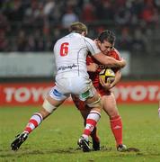 1 January 2011; Wian du Preez, Munster, is tackled by TJ Anderson, Ulster. Celtic League, Munster v Ulster, Thomond Park, Limerick. Picture credit: Brendan Moran / SPORTSFILE