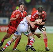 1 January 2011; Donnacha Ryan, Munster, is tackled by TJ Anderson, Ulster. Celtic League, Munster v Ulster, Thomond Park, Limerick. Picture credit: Brendan Moran / SPORTSFILE