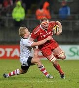 1 January 2011; Mick O'Driscoll, Munster, is tackled by Luke Marshall, Ulster. Celtic League, Munster v Ulster, Thomond Park, Limerick. Picture credit: Brendan Moran / SPORTSFILE