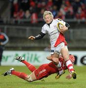 1 January 2011; Jamie Smith, Ulster, is tackled by Niall Ronan, Munster. Celtic League, Munster v Ulster, Thomond Park, Limerick. Picture credit: Brendan Moran / SPORTSFILE