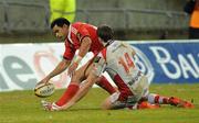1 January 2011; Lifeimi Mafi, Munster, scores his side's final try despite the efforts Tommy Seymour, Ulster. Celtic League, Munster v Ulster, Thomond Park, Limerick. Picture credit: Diarmuid Greene / SPORTSFILE