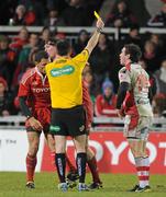 1 January 2011; Doug Howlett, left, Munster, is shown a yellow card by referee Dudley Phillips. Celtic League, Munster v Ulster, Thomond Park, Limerick. Picture credit: Brendan Moran / SPORTSFILE