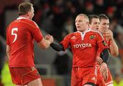 1 January 2011; Munster's Keith Earls with team-mate Mick O'Driscoll, left, after he set up Lifeimi Mafi to score his side's final try. Celtic League, Munster v Ulster, Thomond Park, Limerick. Picture credit: Diarmuid Greene / SPORTSFILE