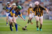 4 September 2016; Kathlyn Stack, Scoil Muire Gan Smál, Lixnaw, Kerry, representing Tipperary, in action against Róisín Maguire, Scoil N Caoimhín Naofa, Philipstown, Dunleer, Louth, representing Kilkenny, during the INTO Cumann na mBunscol GAA Respect Exhibition Go Games at the GAA Hurling All-Ireland Senior Championship Final match between Kilkenny and Tipperary at Croke Park in Dublin. Photo by Piaras Ó Mídheach/Sportsfile