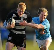 8 January 2011; Karl Miller, Old Belvedere, is tackled by Aran Healy, Garryowen. All-Ireland League Division 1A, Old Belvedere v Garryowen, Anglesea Road, Ballsbridge, Dublin. Picture credit: Stephen McCarthy / SPORTSFILE