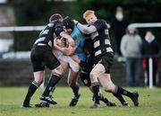 8 January 2011; Anthony Kavanagh, Garryowen, is tackled by Old Belvedere players, from left, Conal Keane, Andy Dunne and Karl Miller. All-Ireland League Division 1A, Old Belvedere v Garryowen, Anglesea Road, Ballsbridge, Dublin. Picture credit: Stephen McCarthy / SPORTSFILE