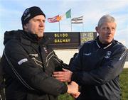 9 January 2011; Sligo manager Kevin Walsh, left, shakes the hand of  Galway manager Thomas O' Flatharta after the game. FBD Connacht League, Sligo v Galway, Enniscrone, Sligo. Picture credit: Ray Ryan / SPORTSFILE