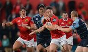 9 September 2016; Darren Sweetnam of Munster is tackled by Gareth Jenkins, left, and Dan Fish of Cardiff Blues during the Guinness PRO12 Round 2 match between Munster and Cardiff Blues at Irish Independent Park in Cork. Photo by Piaras Ó Mídheach/Sportsfile