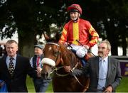 10 September 2016; Jockey Pat Smullen and Khukova are led into the winner's enclosure by owner John Murrell, right, after the KPMG Enterprise Stakes at Leopardstown Racecourse in Dublin. Photo by Cody Glenn/Sportsfile