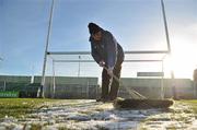 9 January 2011; Gerry Kavanagh, vice chairman of the Laois county board, clears ice off the pitch before the start of the game. O'Byrne Cup, Laois v Wicklow, O'Moore Park, Portlaoise, Co. Laois. Picture credit: David Maher / SPORTSFILE