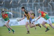 9 January 2011; Seoirse Kenny, Kilkenny, in action against Sean Gannon,11, and John Paul Moore, Carlow. O'Byrne Cup, Carlow v Kilkenny, Dr. Cullen Park, Carlow. Picture credit: Matt Browne / SPORTSFILE