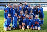 11 January 2011; The girls from Guardian Angels National School, Blackrock, celebrate with the trophy and their medals after winning the Corn Irish Rubies. Allianz Cumann na mBunscol Football Finals, Corn Irish Rubies, Scoil Bhríde, Glasnevin, Dublin v Guardian Angels National School, Blackrock, Dublin. Croke Park, Dublin. Picture credit: Brendan Moran / SPORTSFILE