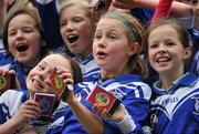 12 January 2011; Players from Scoil San Treasa, Mount Merrion, Dublin, including Jessica Gallagher, left, and Amy Reeves, centre, celebrate with their medals after the game. Allianz Cumann na mBunscol Football Finals, Austin Finn Shield, Our Lady of Good Counsel, Johnstown, Cabinteely, Dublin v Scoil San Treasa, Mount Merrion, Dublin. Croke Park, Dublin. Picture credit: Brendan Moran / SPORTSFILE