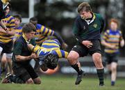 11 January 2011; Paul O'Connor, Skerries Community College, is tackled by Andrew Doran, left, and Shane Farrar, East Glendalough. Duff Cup Final, East Glendalough v Skerries Community College, Templeville Road, Tempelogue, Dublin. Picture credit: David Maher / SPORTSFILE