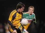 12 January 2011; David Kinnan, DCU, in action against Stephen Lonergan, Offaly. O'Byrne Cup, Offaly v DCU, Rhode, Co. Offaly. Picture credit: Brian Lawless / SPORTSFILE