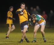 12 January 2011; Martin McElhinney, DCU, in action against Stephen Lonergan, Offaly. O'Byrne Cup, Offaly v DCU, Rhode, Co. Offaly. Picture credit: Brian Lawless / SPORTSFILE