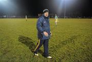 12 January 2011; Offaly manager Tom Cribbin leaves the pitch after talking to his players at half-time. O'Byrne Cup, Offaly v DCU, Rhode, Co. Offaly. Picture credit: Brian Lawless / SPORTSFILE