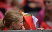 11 September 2016; A young Cork supporter looks on during the Liberty Insurance All-Ireland Intermediate Camogie Championship Final match between Cork and Kilkenny at Croke Park in Dublin. Photo by Eóin Noonan/Sportsfile