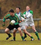 12 January 2011; Aodhán Clabby, St. Benildus Colege, in action against Niall O'Brien, right, and William McGrath, Colaiste Mhuire Mullingar. Leinster Colleges Senior Football A Championship, Round 1, Colaiste Mhuire Mullingar v St. Benildus Colege, St. Loman's GAA Club, Lakepoint Park, Mullingar, Co. Westmeath. Picture credit: Barry Cregg / SPORTSFILE