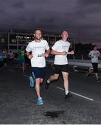 13 September 2016; Seb Daly, left, Team Sportsfile, on his way to 2503 place in a nett time of 25:44 and Eóin Noonan, who finished 2667th in a nett time of  26:13 during the Grant Thornton Corporate 5K Team Challenge 2016 at Dublin Docklands. Photo by Ray McManus/Sportsfile