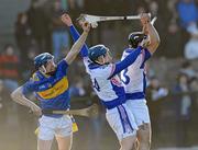 16 January 2011; Eddie Connolly, Tipperary, in action against Michael Sheedy, 14, and Ray McLoughney, 13, Waterford IT. Waterford Crystal Cup, Tipperary v Waterford IT, Clonmel GAA Grounds, Clonmel, Co. Tipperary. Picture credit: Matt Browne / SPORTSFILE