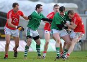 16 January 2011; John Cooke and Liam Costello, left, Limerick, in action against Ger Spillane, right, Alan O'Connor, left, and Brian Shanahan, Cork. McGrath Cup Quarter-Final, Limerick v Cork, Gaelic Grounds, Limerick. Picture credit: Brian Lawless / SPORTSFILE