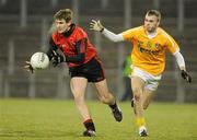 19 January 2011; Conor Maginn, Down, in action against Eamon McNeill, Antrim. Barrett Sports Lighting Dr. McKenna Cup, Section C, Antrim v Down, Casement Park, Belfast, Co. Antrim. Picture credit: Oliver McVeigh / SPORTSFILE