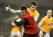 19 January 2011; Ronan Murtagh, Down, in action against Andrew McLean, Antrim. Barrett Sports Lighting Dr. McKenna Cup, Section C, Antrim v Down, Casement Park, Belfast, Co. Antrim. Picture credit: Oliver McVeigh / SPORTSFILE