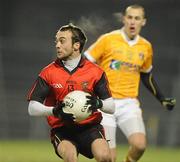 19 January 2011; Conor Laverty, Down, in action against Mark McAleece, Antrim. Barrett Sports Lighting Dr. McKenna Cup, Section C, Antrim v Down, Casement Park, Belfast, Co. Antrim. Picture credit: Oliver McVeigh / SPORTSFILE