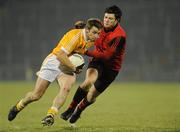 19 January 2011;Tony Scullion, Antrim, in action against Martin Clarke, Down. Barrett Sports Lighting Dr. McKenna Cup, Section C, Antrim v Down, Casement Park, Belfast, Co. Antrim. Picture credit: Oliver McVeigh / SPORTSFILE