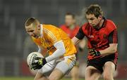 19 January 2011; Paddy Cunningham, Antrim, in action against Kevin Duffin, Down. Barrett Sports Lighting Dr. McKenna Cup, Section C, Antrim v Down, Casement Park, Belfast, Co. Antrim. Picture credit: Oliver McVeigh / SPORTSFILE