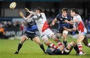 27 December 2010; Pedrie Wannenburg, Ulster, is tackled by Sean O'Brien aided by this team-mates Brian O'Driscoll and Dominic Ryan, Leinster. Celtic League, Ulster v Leinster, Ravenhill Park, Belfast. Picture credit: Oliver McVeigh / SPORTSFILE