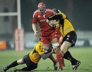 21 January 2011; Billy Holland, Munster A, is tackled by Phil Macenzie, left, and Darren O'Reilly, Esher RFC. British & Irish Cup, Munster A v Esher RFC, Garryowen FC, Dooradoyle, Limerick. Picture credit: Diarmuid Greene / SPORTSFILE