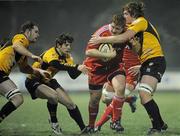 21 January 2011; Stephen Archer, Munster A, is tackled by James Inglis, left, Tom Loizides, centre and Simon Gaynor, Esher RFC. British & Irish Cup, Munster A v Esher RFC, Garryowen FC, Dooradoyle, Limerick. Picture credit: Diarmuid Greene / SPORTSFILE