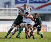 22 January 2011; Tom Court, Ulster Rugby, is tackled Quintin Geldenhuys, Aironi Rugby. Heineken Cup Pool 4 Round 6, Aironi Rugby v Ulster Rugby, Stadio Luigi Zaffanella, Aironi, Italy. Picture credit: Oliver McVeigh / SPORTSFILE