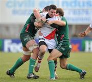 22 January 2011; Paddy Wallace, Ulster Rugby, is tackled by Vickus Liebenberg, left, and Rodd Penney, Aironi Rugby. Heineken Cup Pool 4 Round 6, Aironi Rugby v Ulster Rugby, Stadio Luigi Zaffanella, Aironi, Italy. Picture credit: Oliver McVeigh / SPORTSFILE