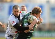 22 January 2011; Mickey Wilson, Aironi Rugby, is tackled by Ian Humphreys, Ulster Rugby. Heineken Cup Pool 4 Round 6, Aironi Rugby v Ulster Rugby, Stadio Luigi Zaffanella, Aironi, Italy. Picture credit: Oliver McVeigh / SPORTSFILE