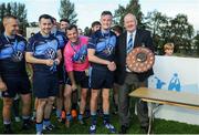 17 September 2016; Alex Kenny of St Jude's is presented with the shield by Denis Ryan, Vice President of St Jude's GAA following the shield final during the Volkswagen Junior Football 7s at St Judes GAA Club, Wellington Lane, Dublin.  Photo by Sam Barnes/Sportsfile