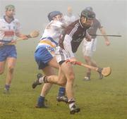 23 January 2011; Tony Og Regan, Galway, in action against Tom Brady, DIT. Walsh Cup Quarter-Final, Galway v DIT, Ballinasloe, Co. Galway. Picture credit: Ray Ryan / SPORTSFILE