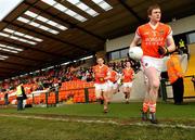 23 January 2011; Ciaran Toner, right, leads out the Armagh team for the start of the match. Barrett Sports Lighting Dr. McKenna Cup Section A, Armagh v Antrim, Athletic Grounds, Armagh. Picture credit: Michael Cullen / SPORTSFILE