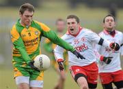23 January 2011; Dermot Molloy, Donegal, in action against Dermot Carlin, Tyrone. Barrett Sports Lighting Dr. McKenna Cup Section A, Tyrone v Donegal, Edendork, Co. Tyrone. Picture credit: Oliver McVeigh / SPORTSFILE