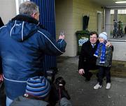 23 January 2011; An Taoiseach Brian Cowen, T.D., gets his picture taken with eight year old James Connolly, from Portlaoise. AIB Leinster GAA Football All-Ireland Senior Club Championship Final, Rhode v Kilmacud Crokes, O'Moore Park, Portlaoise, Co. Laois. Picture credit: Dáire Brennan / SPORTSFILE