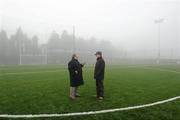 23 January 2011; Match referee Barry Kelly and Kilkenny Chairman Ned Quinn consider the conditions prevailing at the Heywood Community Grounds before deciding to switch the game to  St Patrick's GAA Club, Ballyragget, Co Kilkenny. Walsh Cup, Kilkenny v NUI Galway, Heywood Community School, Balinakill, Co. Laois. Picture credit: Ray McManus / SPORTSFILE