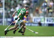 16 September 2001; Limerick's Mark Keane in a race for possession with Wexford's Niall Maguire. Limerick v Wexford, All-Ireland U-21 Hurling Final, Semple Stadium, Thurles. Picture credit; Brendan Moran / SPORTSFILE