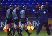18 September 2001; Shelbourne manager, Dermot Keely, right, remonstrates with Referee's assistant, Joe O'Brien, second from right and Referee Dick O'Hanlon, second from left, as the teams left the pitch for half-time. eircom league Premier Division. Tolka Park, Dublin. Shelbourne v Derry City.  Soccer. Picture credit; David Maher / SPORTSFILE *EDI*