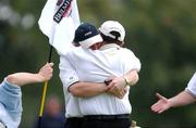 21 September 2001; Gary Rutherford, Ballyclare Golf Club, is congratulated  by his caddie Owen Beggs after sinking a putt on the 17th to win the final of the Bulmers Junior Cup at Newlands Golf Club, Dublin. Picture credit; Ray McManus / SPORTSFILE